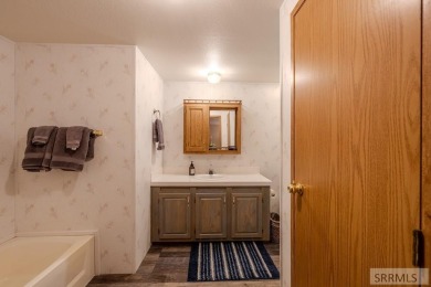 Location, location, location! Just 20 minutes from Yellowstone on Island Park Village Resort Golf Course in Idaho - for sale on GolfHomes.com, golf home, golf lot