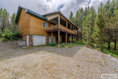 Location, location, location! Just 20 minutes from Yellowstone on Island Park Village Resort Golf Course in Idaho - for sale on GolfHomes.com, golf home, golf lot