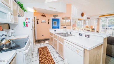 You'll love this 2 bedroom, 2 bath upper condo with a spacious on Brunswick Plantation and Golf Resorts in North Carolina - for sale on GolfHomes.com, golf home, golf lot