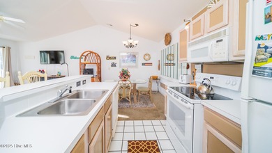 You'll love this 2 bedroom, 2 bath upper condo with a spacious on Brunswick Plantation and Golf Resorts in North Carolina - for sale on GolfHomes.com, golf home, golf lot