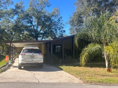 Discover this beautifully maintained two bedroom two bathroom on Whisperwood Golf Course in Florida - for sale on GolfHomes.com, golf home, golf lot