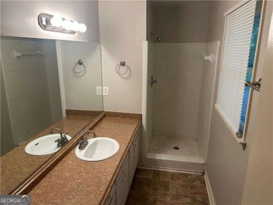 This charming 4-bedroom 3-bath home is perfect for a growing on Hidden Hills Country Club in Georgia - for sale on GolfHomes.com, golf home, golf lot