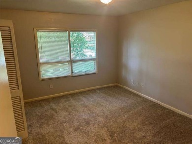 This charming 4-bedroom 3-bath home is perfect for a growing on Hidden Hills Country Club in Georgia - for sale on GolfHomes.com, golf home, golf lot