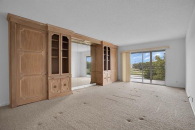 Corner residence offering stunning water views from every window on Wynmoor Golf Course in Florida - for sale on GolfHomes.com, golf home, golf lot