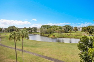 Corner residence offering stunning water views from every window on Wynmoor Golf Course in Florida - for sale on GolfHomes.com, golf home, golf lot