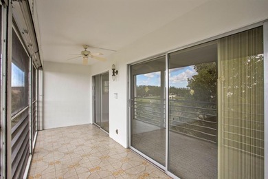 Corner residence offering stunning water views from every window on Wynmoor Golf Course in Florida - for sale on GolfHomes.com, golf home, golf lot