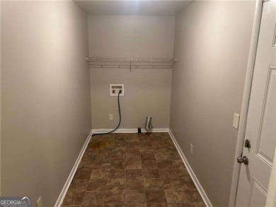 This charming 4-bedroom 3-bath home is perfect for a growing on Hidden Hills Country Club in Georgia - for sale on GolfHomes.com, golf home, golf lot