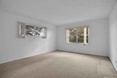 Corner residence offering stunning water views from every window on Wynmoor Golf Course in Florida - for sale on GolfHomes.com, golf home, golf lot