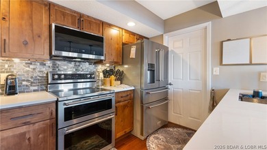 Beautifully updated lakefront home at the 3MM in the highly on Seasons Ridge At Four Seasons in Missouri - for sale on GolfHomes.com, golf home, golf lot