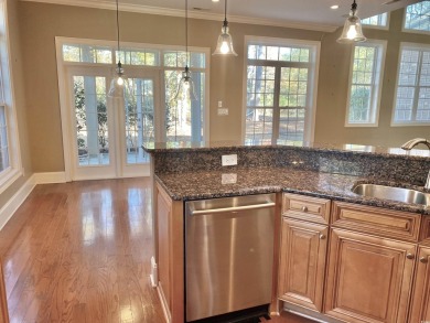 This spacious traditional home has volume ceilings throughout on Heron Point Golf Club in South Carolina - for sale on GolfHomes.com, golf home, golf lot