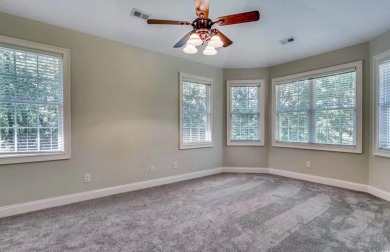 This spacious traditional home has volume ceilings throughout on Heron Point Golf Club in South Carolina - for sale on GolfHomes.com, golf home, golf lot