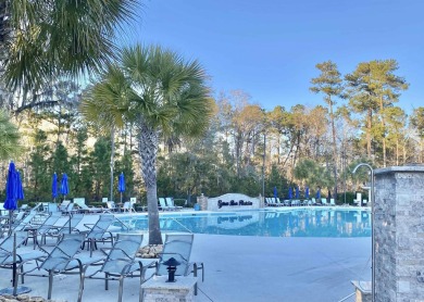 This spacious traditional home has volume ceilings throughout on Heron Point Golf Club in South Carolina - for sale on GolfHomes.com, golf home, golf lot