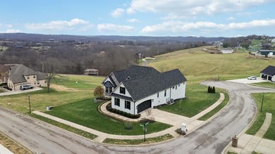Experience refined luxury in this custom-built home in the on The Bull At Boones Trace in Kentucky - for sale on GolfHomes.com, golf home, golf lot