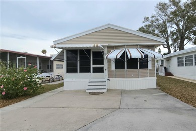 TURNKEY MOBILE HOME IN ACTIVE 55+ COMMUNITY! This one bedroom, 1 on River Run Golf Links in Florida - for sale on GolfHomes.com, golf home, golf lot