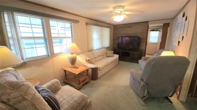 TURNKEY MOBILE HOME IN ACTIVE 55+ COMMUNITY! This one bedroom, 1 on River Run Golf Links in Florida - for sale on GolfHomes.com, golf home, golf lot