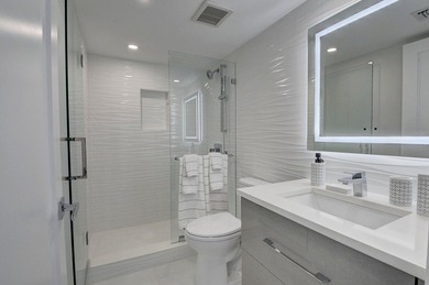This expanded 2-bedroom, 2-bathroom Lakewood condo was renovated on Boca West Golf and Country Club in Florida - for sale on GolfHomes.com, golf home, golf lot