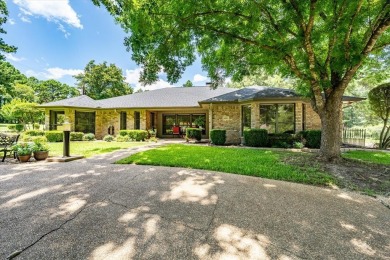 Absolutely stunning brick home in highly sought-after gated on Holly Lake Ranch Golf Club in Texas - for sale on GolfHomes.com, golf home, golf lot