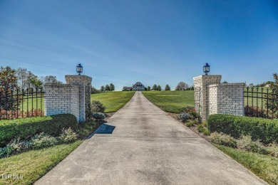 A stately brick-column entrance leads to this breathtaking on The Crossings Golf Club in Tennessee - for sale on GolfHomes.com, golf home, golf lot