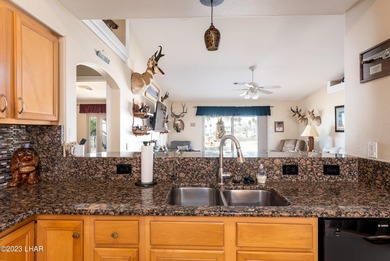 Welcome to this spacious 3-bedroom, 2-bathroom home with 1,826 on London Bridge Golf Course in Arizona - for sale on GolfHomes.com, golf home, golf lot