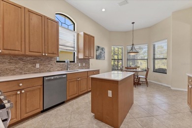 Situated on over a quarter acre of tranquil waterfront in the on Legacy Golf Club in Florida - for sale on GolfHomes.com, golf home, golf lot