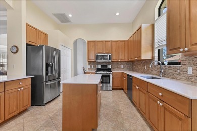 Situated on over a quarter acre of tranquil waterfront in the on Legacy Golf Club in Florida - for sale on GolfHomes.com, golf home, golf lot