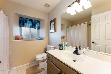 Welcome to this spacious 3-bedroom, 2-bathroom home with 1,826 on London Bridge Golf Course in Arizona - for sale on GolfHomes.com, golf home, golf lot