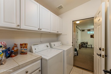 Welcome to this spacious 3-bedroom, 2-bathroom home with 1,826 on London Bridge Golf Course in Arizona - for sale on GolfHomes.com, golf home, golf lot