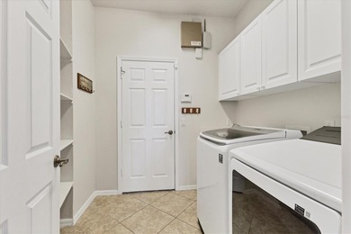 Situated on over a quarter acre of tranquil waterfront in the on Legacy Golf Club in Florida - for sale on GolfHomes.com, golf home, golf lot