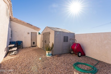 Welcome to this spacious 3-bedroom, 2-bathroom home with 1,826 on London Bridge Golf Course in Arizona - for sale on GolfHomes.com, golf home, golf lot