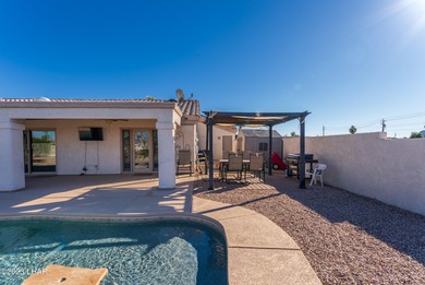 Welcome to this spacious 3-bedroom, 2-bathroom home with 1,826 on London Bridge Golf Course in Arizona - for sale on GolfHomes.com, golf home, golf lot