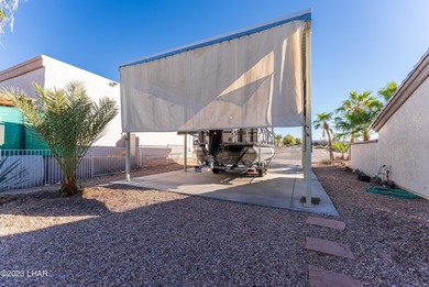 Welcome to this spacious 3-bedroom, 2-bathroom home with 1,826 on London Bridge Golf Course in Arizona - for sale on GolfHomes.com, golf home, golf lot