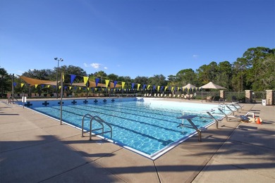 Situated on over a quarter acre of tranquil waterfront in the on Legacy Golf Club in Florida - for sale on GolfHomes.com, golf home, golf lot