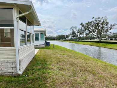 Charming Waterfront Retreat - 8711 26th Ave. E, Sun Key Village on River Run Golf Links in Florida - for sale on GolfHomes.com, golf home, golf lot