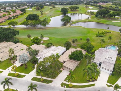 Enjoy this lovely 3 bedroom house overlooking the golf course on Fountains Golf and Country Club in Florida - for sale on GolfHomes.com, golf home, golf lot