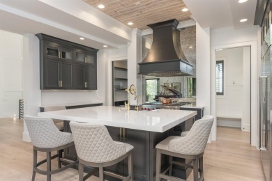 Indulge in luxury lake life in this 6-bedroom, 6.5- bath lake on Reynolds Lake Oconee - The Oconee in Georgia - for sale on GolfHomes.com, golf home, golf lot