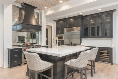 Indulge in luxury lake life in this 6-bedroom, 6.5- bath lake on Reynolds Lake Oconee - The Oconee in Georgia - for sale on GolfHomes.com, golf home, golf lot