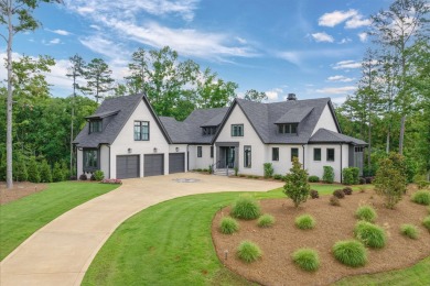 Indulge in luxury lake life in this 6-bedroom, 6.5- bath lake on Reynolds Lake Oconee - The Oconee in Georgia - for sale on GolfHomes.com, golf home, golf lot