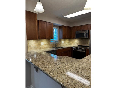 Beautifully Updated Mission Lake Townhome Backing to Scenic on Minor Park Golf Course in Missouri - for sale on GolfHomes.com, golf home, golf lot