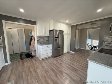 Newer metal roof, newer vinyl siding, newer LVP flooring on Indian Rock Golf Club in Missouri - for sale on GolfHomes.com, golf home, golf lot