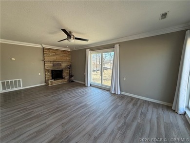 Newer metal roof, newer vinyl siding, newer LVP flooring on Indian Rock Golf Club in Missouri - for sale on GolfHomes.com, golf home, golf lot