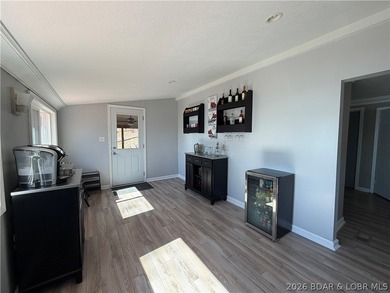 Newer metal roof, newer vinyl siding, newer LVP flooring on Indian Rock Golf Club in Missouri - for sale on GolfHomes.com, golf home, golf lot