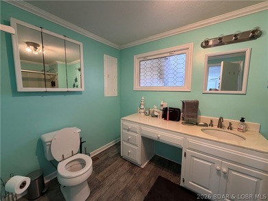 Newer metal roof, newer vinyl siding, newer LVP flooring on Indian Rock Golf Club in Missouri - for sale on GolfHomes.com, golf home, golf lot