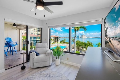 Premium WATERFRONT CORNER CONDO WITH PANORAMIC WATER VIEWS ON on Isla Del Sol Yacht and Country Club in Florida - for sale on GolfHomes.com, golf home, golf lot