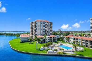 Premium WATERFRONT CORNER CONDO WITH PANORAMIC WATER VIEWS ON on Isla Del Sol Yacht and Country Club in Florida - for sale on GolfHomes.com, golf home, golf lot