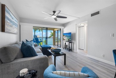 Premium WATERFRONT CORNER CONDO WITH PANORAMIC WATER VIEWS ON on Isla Del Sol Yacht and Country Club in Florida - for sale on GolfHomes.com, golf home, golf lot