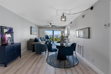 Premium WATERFRONT CORNER CONDO WITH PANORAMIC WATER VIEWS ON on Isla Del Sol Yacht and Country Club in Florida - for sale on GolfHomes.com, golf home, golf lot