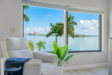 Premium WATERFRONT CORNER CONDO WITH PANORAMIC WATER VIEWS ON on Isla Del Sol Yacht and Country Club in Florida - for sale on GolfHomes.com, golf home, golf lot
