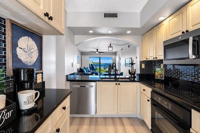 Premium WATERFRONT CORNER CONDO WITH PANORAMIC WATER VIEWS ON on Isla Del Sol Yacht and Country Club in Florida - for sale on GolfHomes.com, golf home, golf lot