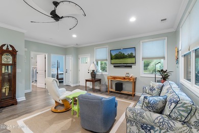 Welcome to 301 NE 51st Street where island life meets everyday on Founders Club At St. James Plantation in North Carolina - for sale on GolfHomes.com, golf home, golf lot