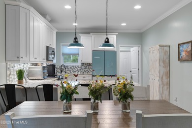 Welcome to 301 NE 51st Street where island life meets everyday on Founders Club At St. James Plantation in North Carolina - for sale on GolfHomes.com, golf home, golf lot